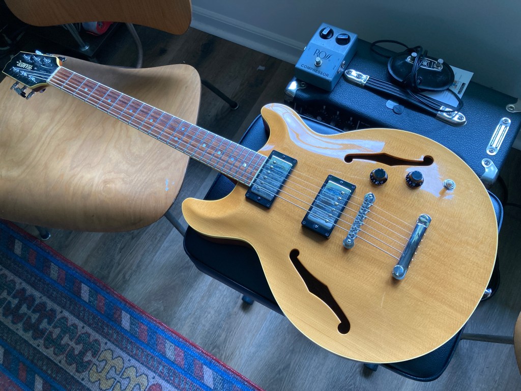 A Hamer Newport semi-hollow electric guitar.